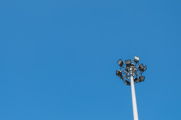 Spotlight tower with blue sky, Copy space