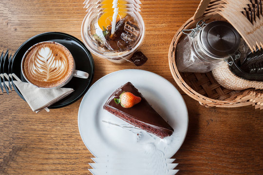 Composite picture of chocolate cake, cappucino, peach tea and se