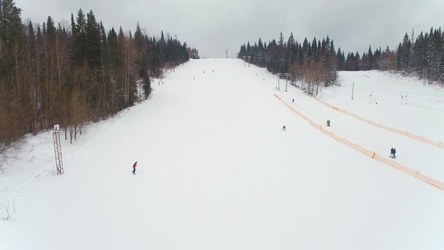 Lovers of winter sports on the ski slopes. aerial video