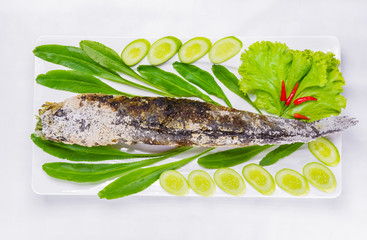 grill striped snakehead fish with salt coated