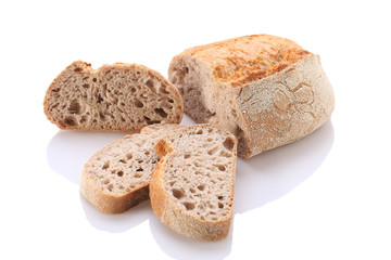 loaf and slices of bread on a white background