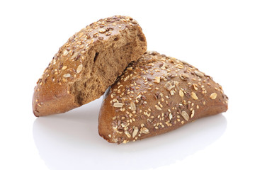 Brown bun sprinkled with flax seeds, sunflower, pumpkin and sesa