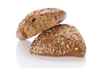 Brown bun sprinkled with flax seeds, sunflower, pumpkin and sesa