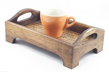 Coffee cup on wooden tray isolated on white background