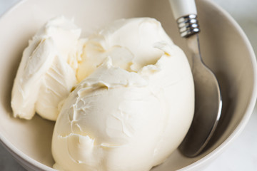 Fototapeta na wymiar Fresh mascarpone in white bowl