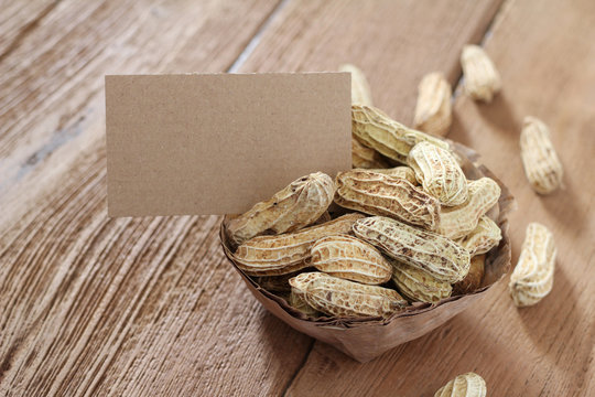 boiled peanut with blank cards on wooden table