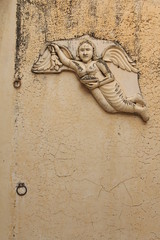 Guardian Angel - relief on stone wall