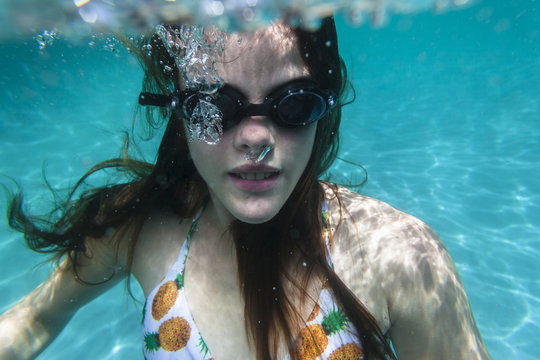 Girl Underwater swimming pool summer fun