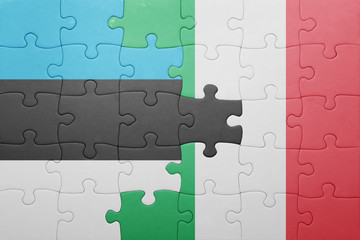 puzzle with the national flag of italy and estonia