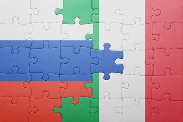 puzzle with the national flag of italy and russia