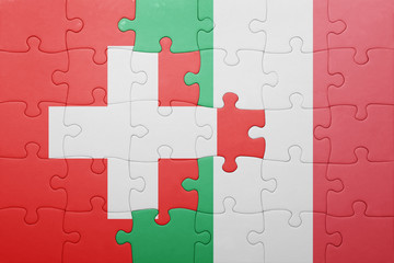 puzzle with the national flag of italy and switzerland
