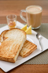 Oriental breakfast set in Malaysia consisting of teh tarik and toast bread