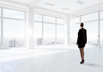 Obraz na płótnie Canvas Businesswoman in top floor office