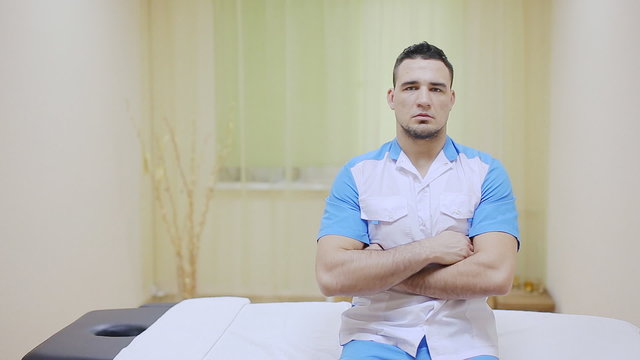 massage  therapist standing in medical office