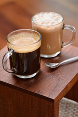 Hot coffee and tea in a transparent cup