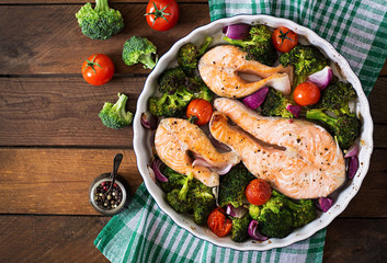 Baked salmon steak with vegetables. Diet menu. Top view