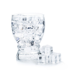full glass of fresh cool transparent water with ice