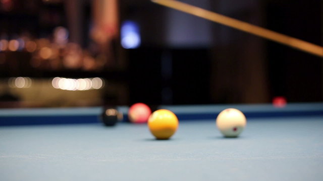Eight-ball pool billiards player hesitates next shot