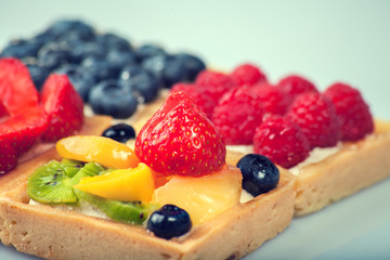 Shortcakes with berries on white background
