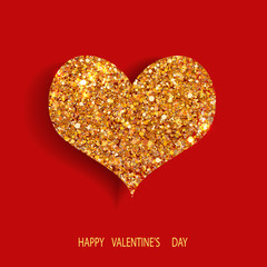golden heart with sparkles on a red background