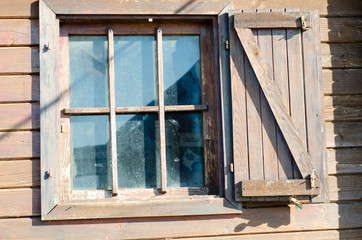 Fototapeta na wymiar Old wooden window on country house
