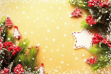 Christmas fir tree branches with toys on paper background