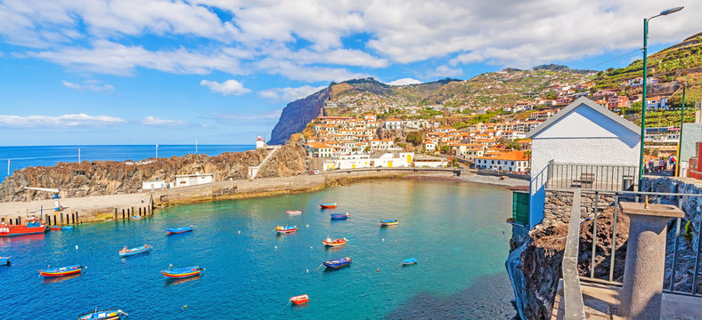 Panorama harbor of Camara de Lobos, Madeira with fishing boats