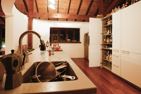 Kitchen With A Sink Full Of Dishes