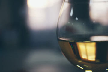 Glass of wine on blurred background