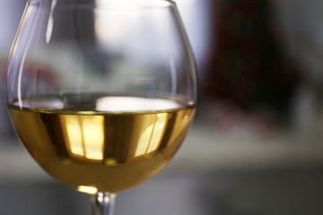 Glass of wine on blurred background