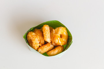 Thai donut, donut molasses in banana leaves.
