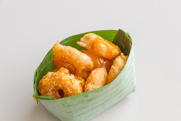 Thai donut, donut molasses in banana leaves.