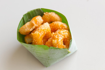 Thai donut, donut molasses in banana leaves.