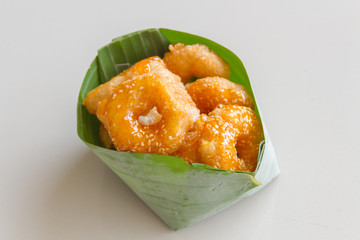Thai donut, donut molasses in banana leaves.