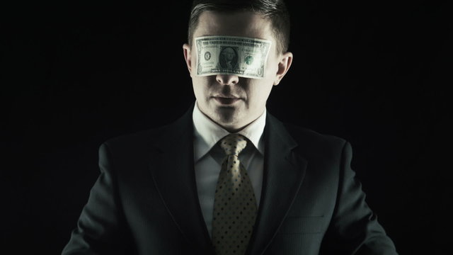 Corruption, The person in a suit closed a eyes a one-dollar banknote