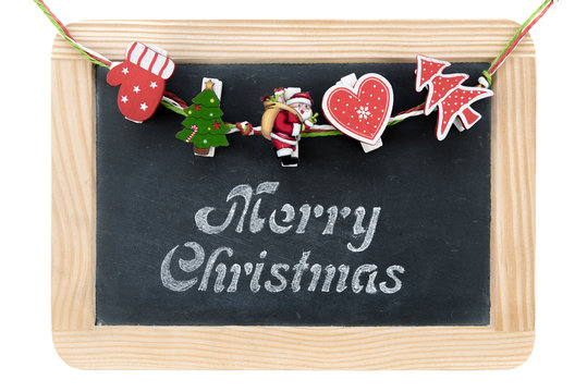 Christmas decorations over Vintage Chalkboard with wooden frame with Merry Christmas greeting