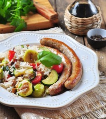 Fried rice with Brussels sprouts, mushrooms, zucchini, garlic, cherry tomatoes, basil, parsley and chicken sausages