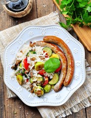 Fried rice with Brussels sprouts, mushrooms, zucchini, garlic, cherry tomatoes, basil, parsley and chicken sausages