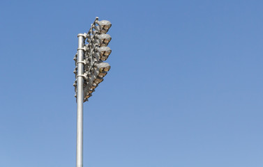 Fototapeta premium Spotlights soccer stadium with blue sky