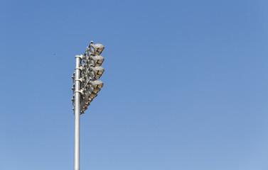 Fototapeta premium Spotlights soccer stadium with blue sky
