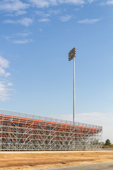 Fototapeta premium Spotlights soccer stadium with blue sky