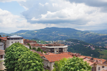 Fototapeta na wymiar Panorama of the mountains, the countryside and cloudy sky