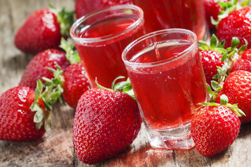 Red strawberry drink and fresh berries, selective focus