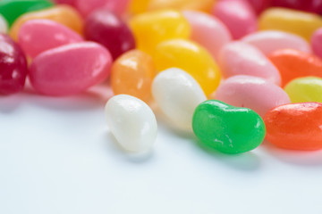 Jelly beans on white background close up