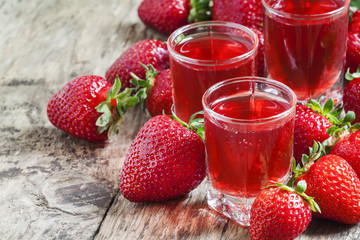 Red strawberry drink and fresh berries, selective focus