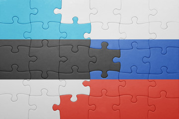 puzzle with the national flag of estonia and russia
