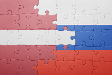 puzzle with the national flag of latvia and russia