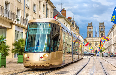 Fototapeta na wymiar Tram on Jeanne d'Arc street in Orleans - France