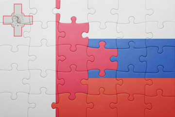 puzzle with the national flag of malta and russia