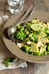 Warm salad from barley,broccoli and fried chicken.
